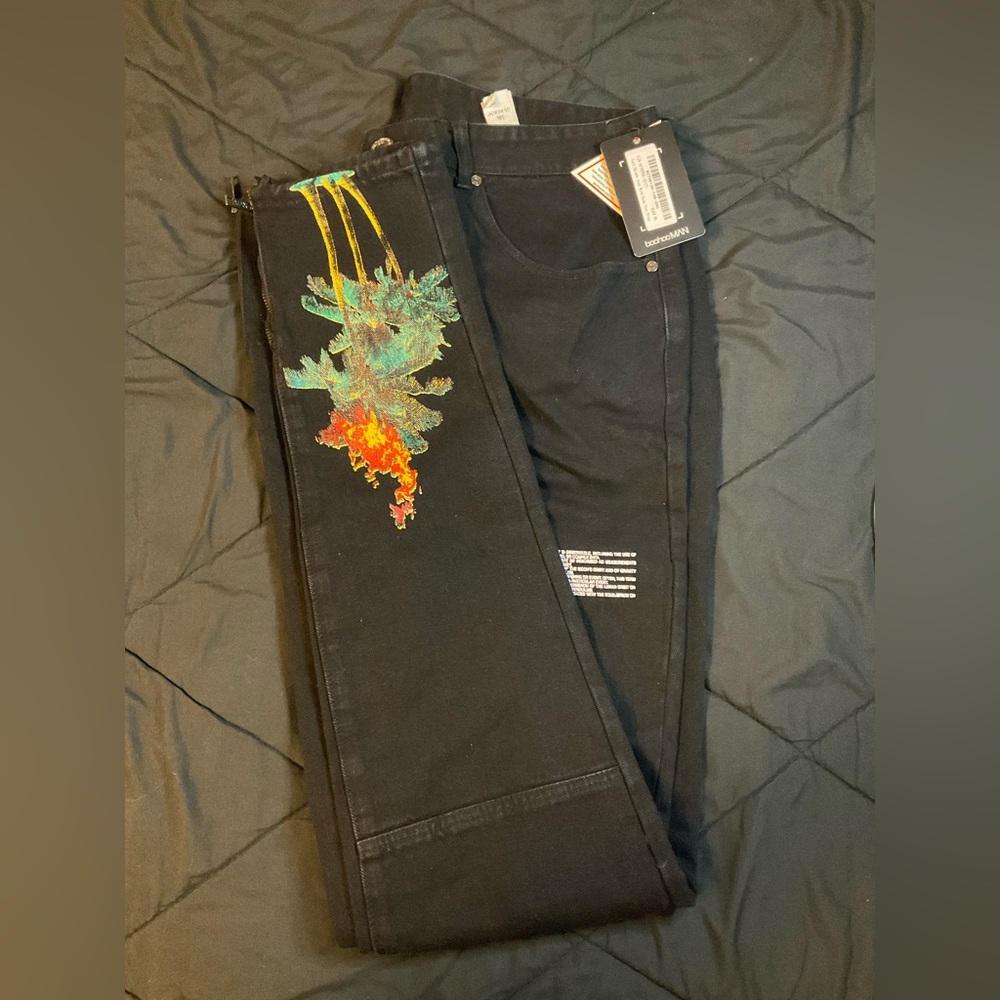 Black skinny jeans with palm trees on the legs